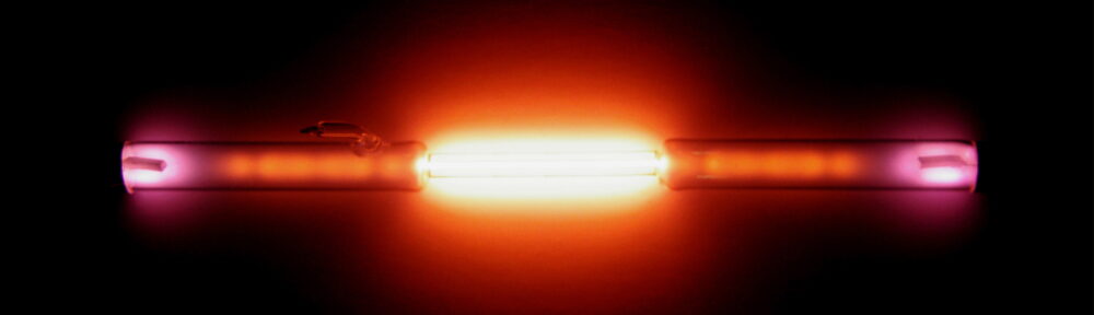 Spectrum = gas discharge tube: the noble gas: helium He. Used with 1,8kV, 18mA, 35kHz. ≈8" length. Alchemist-hp